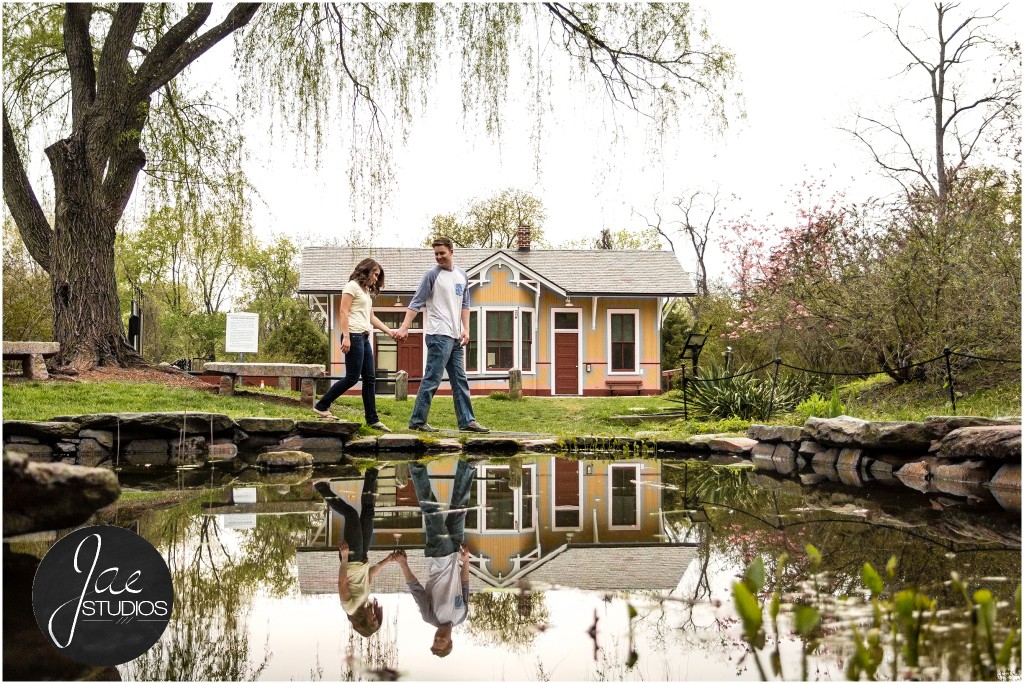 Hannah & Nick-72, Lynchburg Couple Session, Pond, Stones, Lily, Holding Hands, House, Tree, Water, Reflection, Blue and White Shirt, Jeans, White Shirt, Brunette