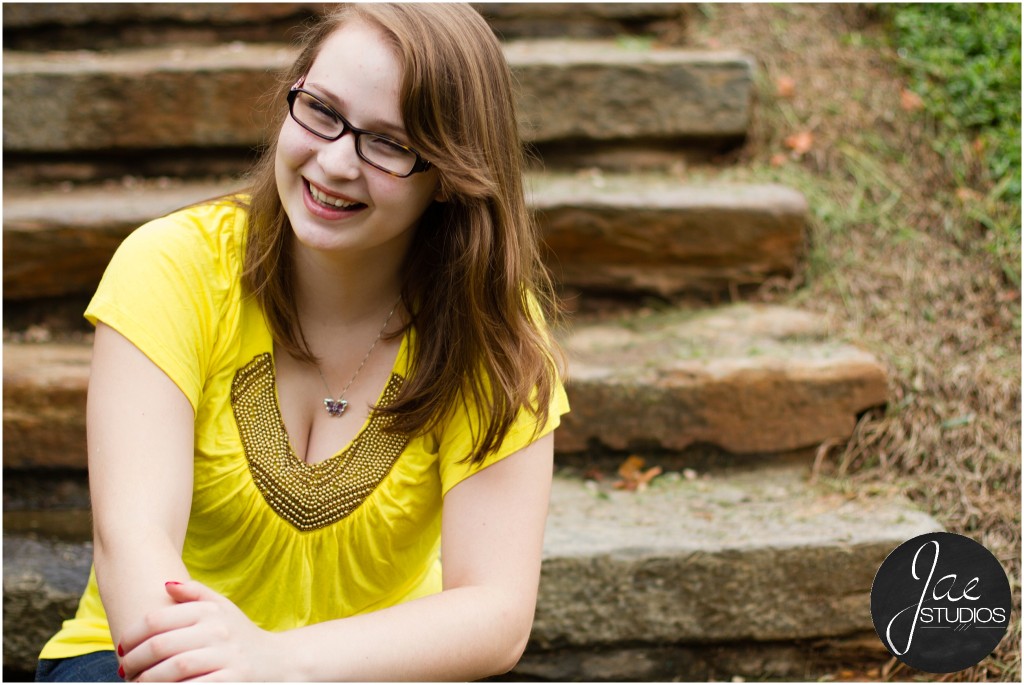 Lynchburg Senior Girl Emily 2014. She is laughing while relaxing on the stairs.
