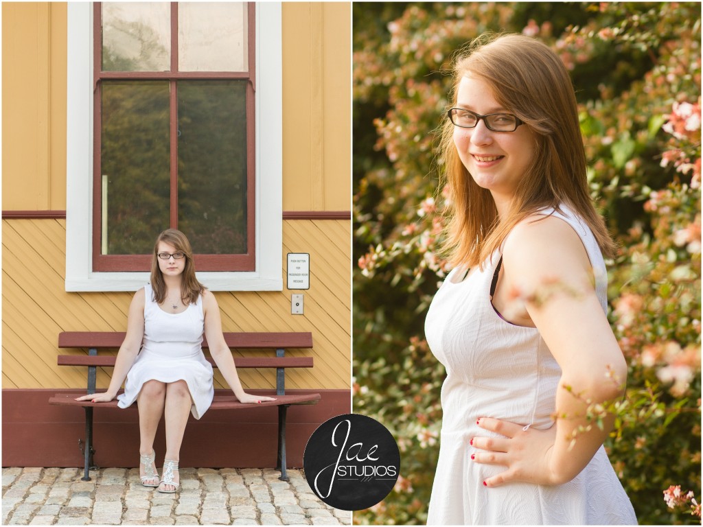 Lynchburg Senior Girl Emily 2014. She is sitting in a white dress on a bench in front of a large window with the cobblestone street at her feet. Then, she is posing in front of a bush with pink flowers.
