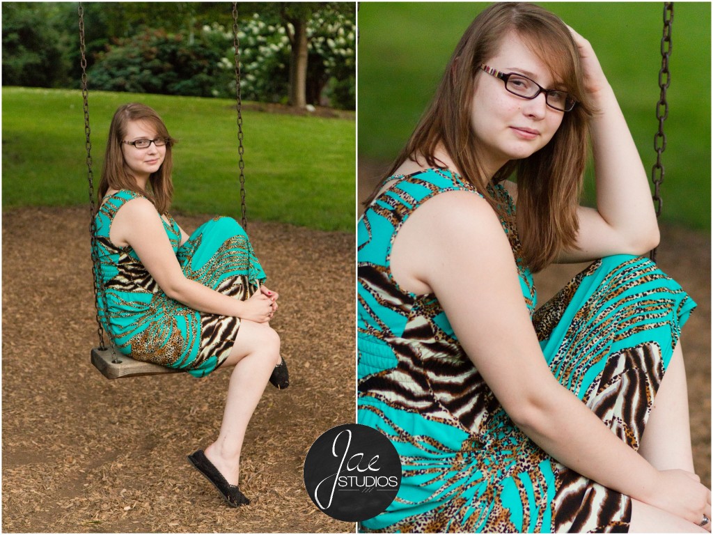 Lynchburg Senior Girl Emily 2014. Emily is perched on a swing while wearing a blue and gold dress with spots of black and white and black flats.