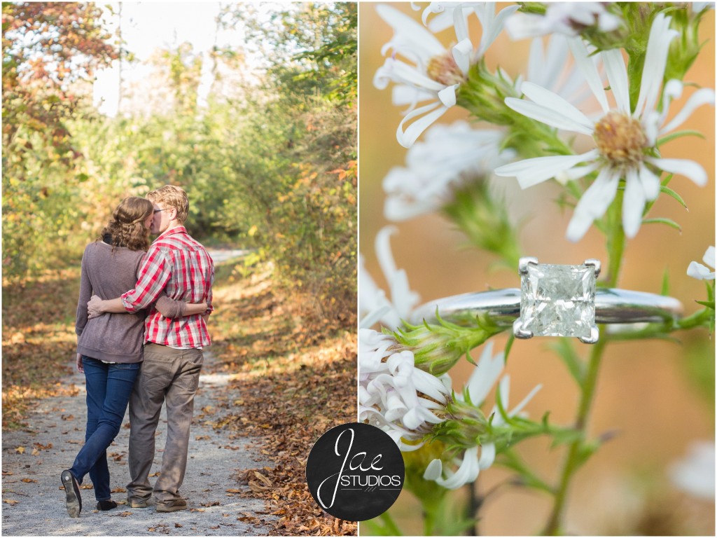 Lynchburg Engagement Patrick and Rebecca. Kissing on a path in the woods and princess cut diamond ring on white wildflower.